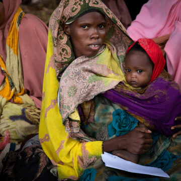 Somalia. Ayan (25) with her daughter Mushtaq (15 months) in the waiting area of the WFP funded Kabasa MAM Health Center WFP takes drastic action to avert projected famine